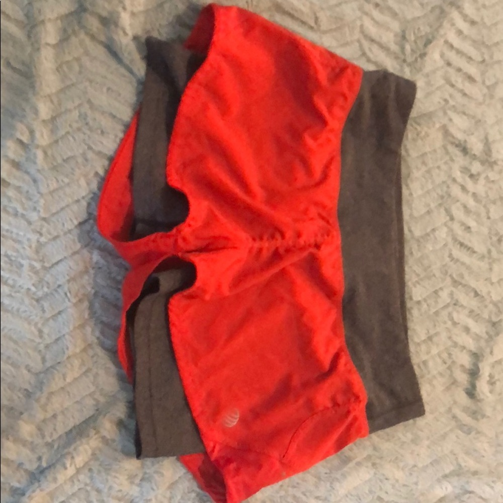 Orange and gray running shorts